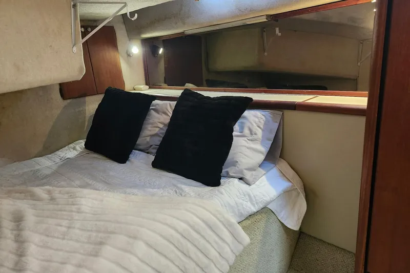 Slide: The Image of 1994 Bayliner 3888 Motoryacht docked at marina under clear blue sky. - 3