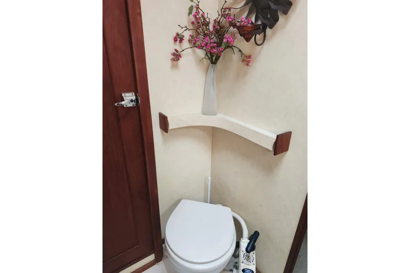 Slide: The Image of 1994 Bayliner 3888 Motoryacht docked near a bridge on a sunny day. - 4