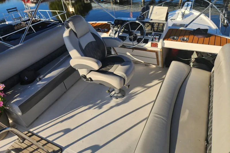 Slide: The Image of Garmin GPS device on 1994 Bayliner 3888 Motoryacht dashboard, with water view. - 7