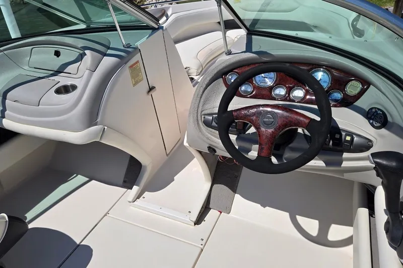 Slide: The Image of 2003 Monterey 228SI Montura Bowrider dashboard with steering wheel and instrument panel. - 11