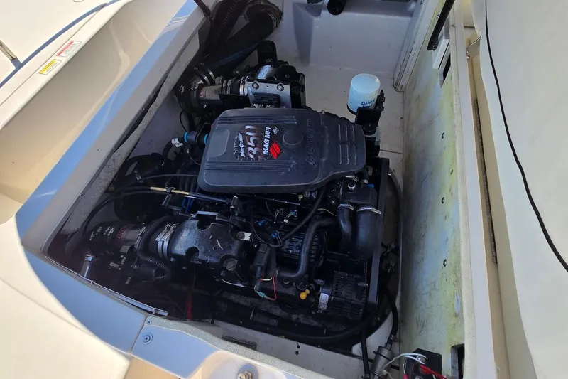 Slide: The Image of Engine compartment of a 2003 Monterey 228SI Montura Bowrider boat. - 15