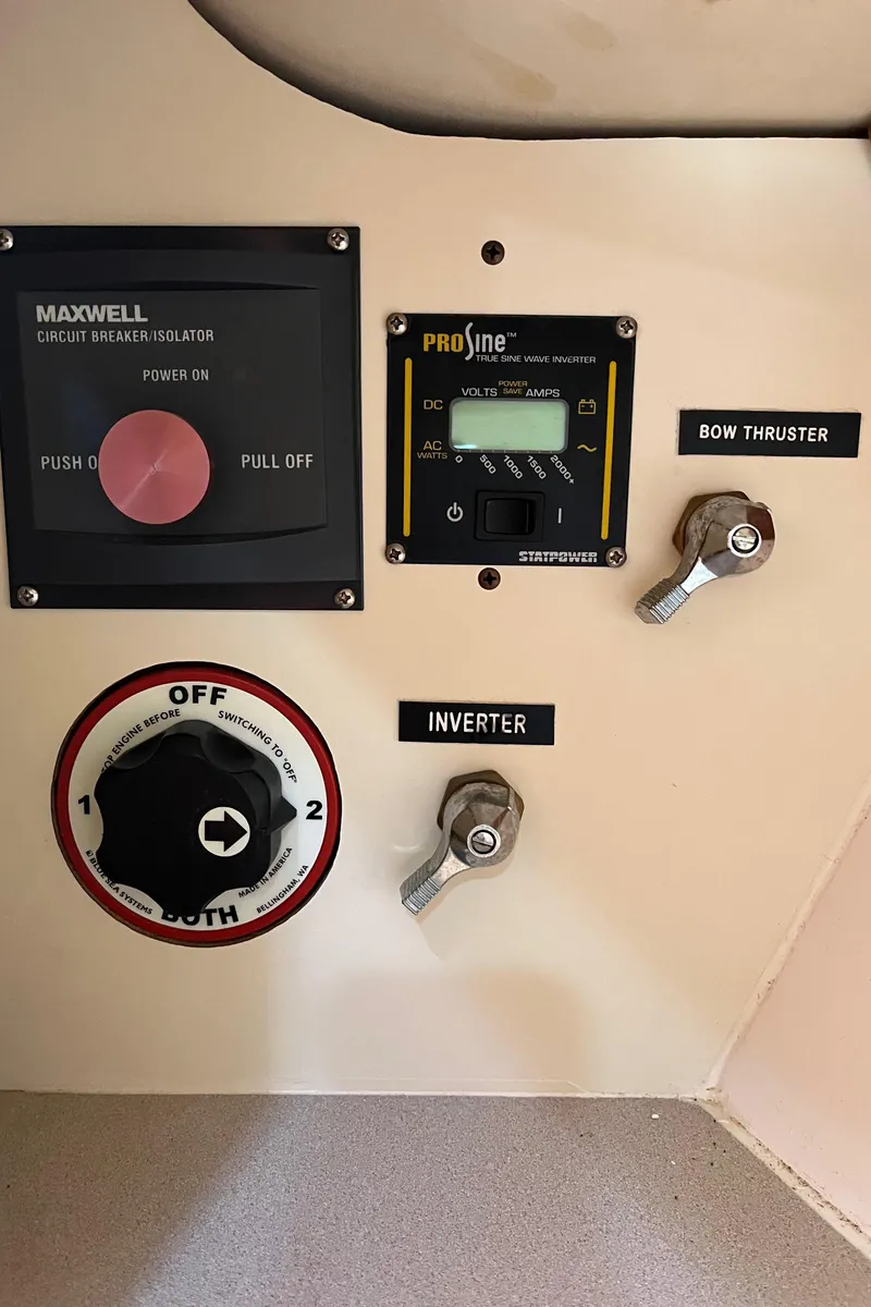 Slide: The Image of Control panel of a 2001 Legacy Yachts 28 Express with bow thruster and inverter switches. - 10