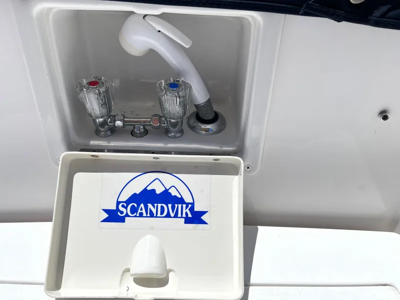 Slide: The Image of Scandvik faucet on 2001 Legacy Yachts 28 Express, featuring dual temperature controls. - 28