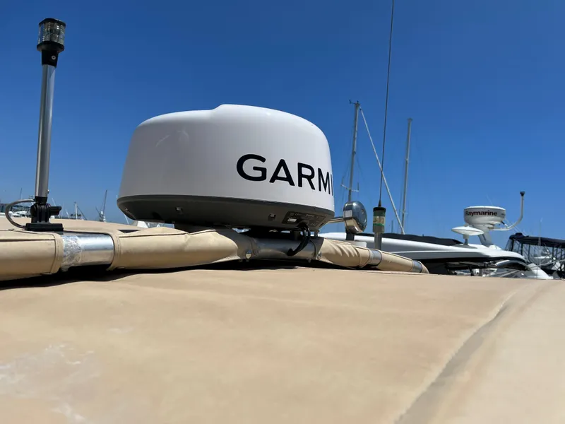 Slide: The Image of Garmin radar on 2001 Legacy Yachts 28 Express, clear blue sky background. - 29
