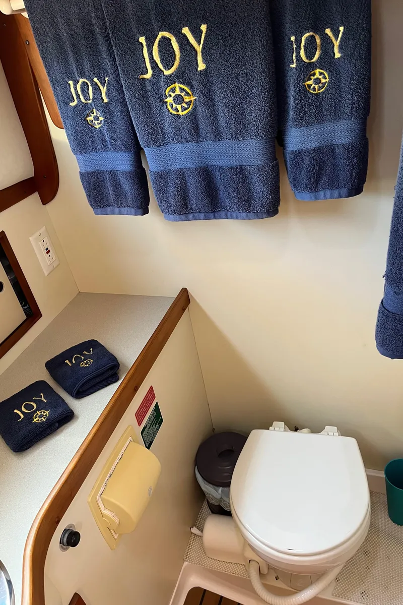 Slide: The Image of Bathroom in 2001 Legacy Yachts 28 Express with "JOY" embroidered towels. - 5