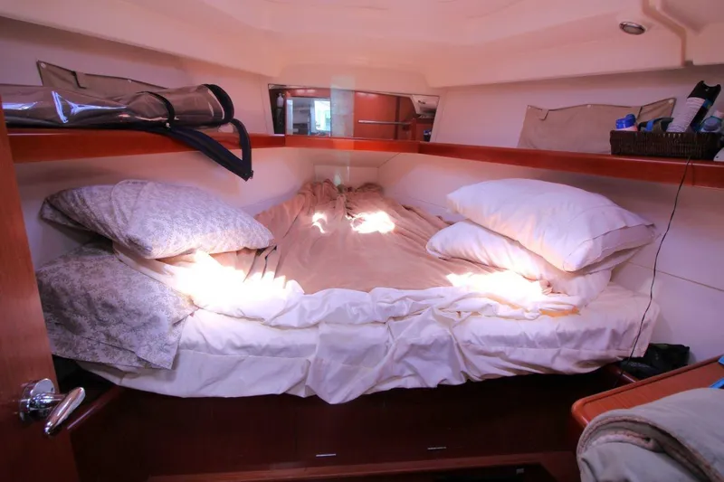 Slide: The Image of Cozy cabin interior of 2016 Beneteau Oceanis 40 sailboat with pillows and bedding. - 13