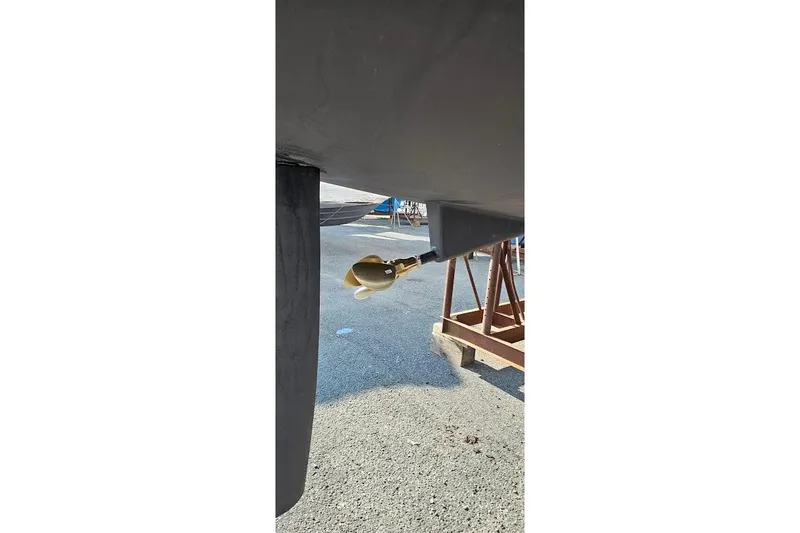 Slide: The Image of Beneteau Oceanis 40 (2016) sailboat propeller and rudder detail on dry dock. - 21