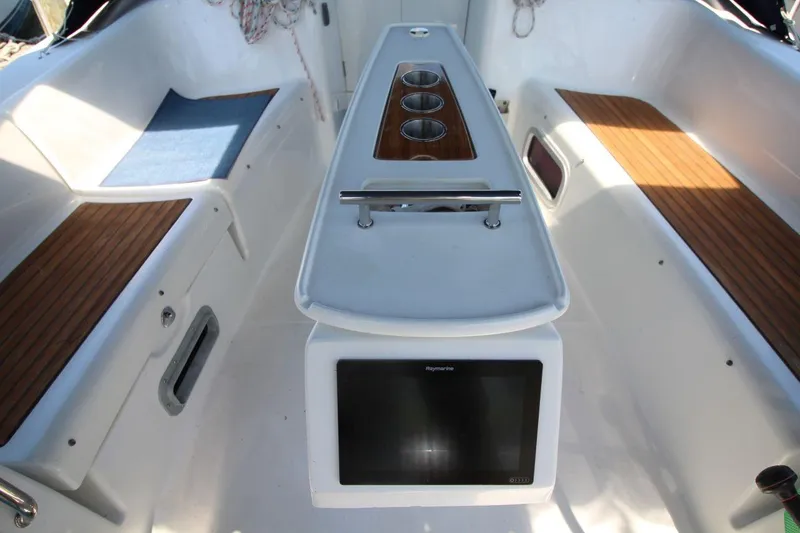 Slide: The Image of Cockpit of 2016 Beneteau Oceanis 40 with teak seating and navigation display. - 5