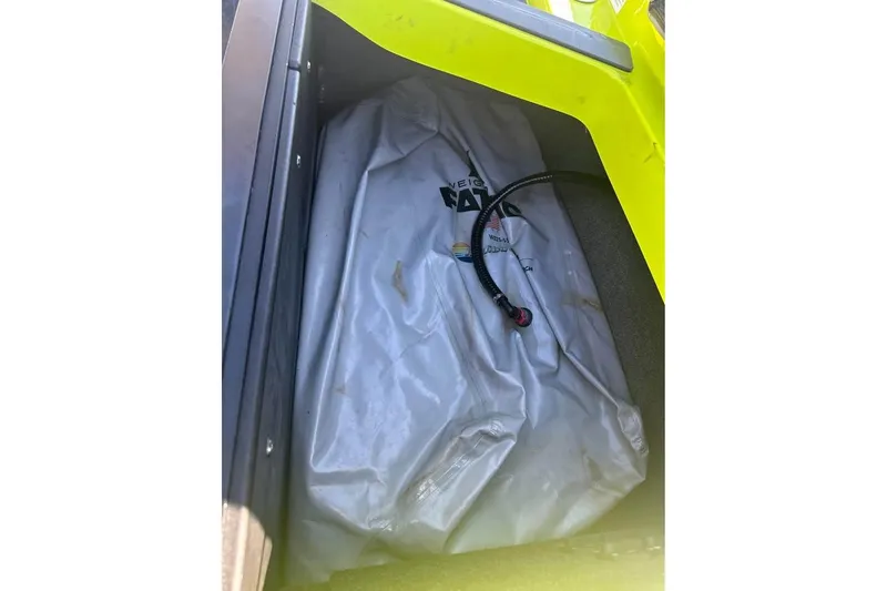 Slide: The Image of 2023 Axis A225 boat ballast bag with hose in storage compartment. - 9