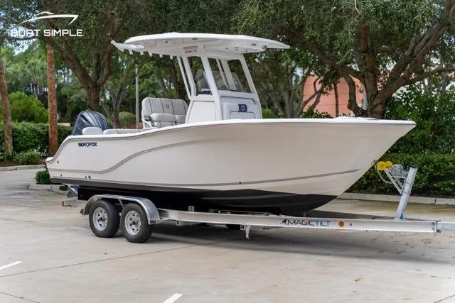 Slide: The Image of 2026 Sea Fox 228 Commander boat on trailer, parked outdoors. - 4