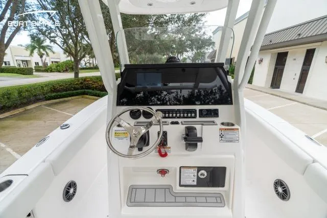 Slide: The Image of 2026 Sea Fox 228 Commander boat console with steering wheel and controls. - 10