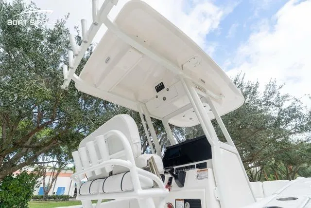 Slide: The Image of 2026 Sea Fox 228 Commander boat with T-top and seating, viewed from below. - 11