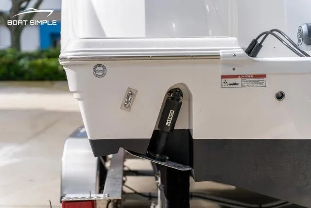 Slide: The Image of 2026 Sea Fox 228 Commander boat on trailer, close-up of stern and trim tab. - 12