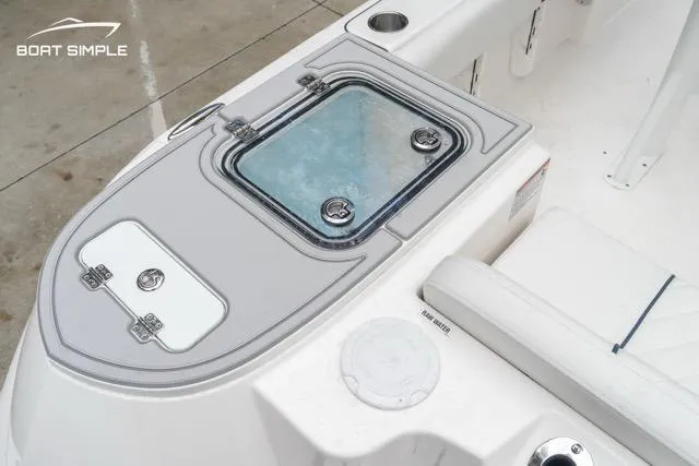 Slide: The Image of 2026 Sea Fox 228 Commander boat interior with storage compartments and seating. - 19