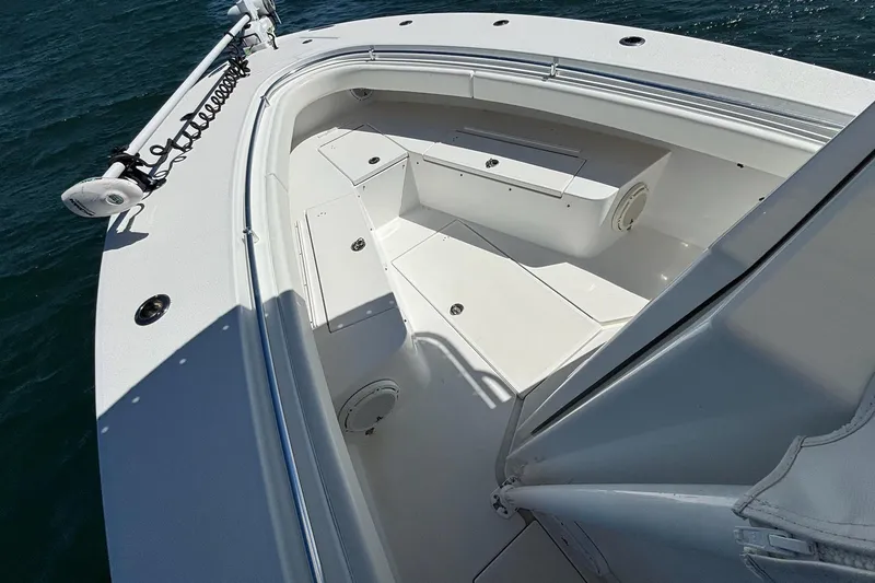 Slide: The Image of 2016 Onslow Bay 27 XS boat deck with seating, on calm water. - 11