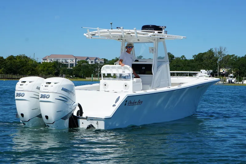 Slide: The Image of 2016 Onslow Bay 27 XS boat with twin Mercury 350 engines on a sunny day. - 9