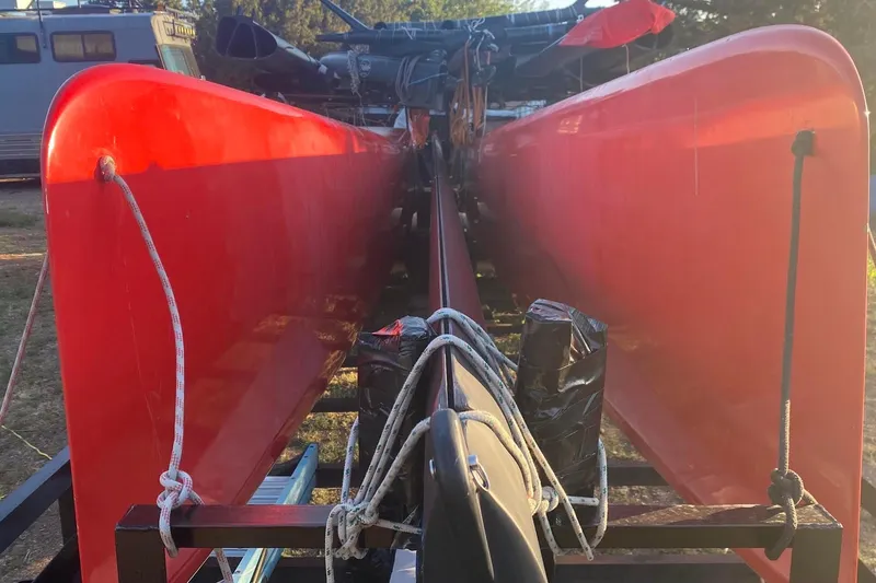 Slide: The Image of Red Marstrom MC 32 catamaran from 2011 on a trailer, viewed from the front. - 8