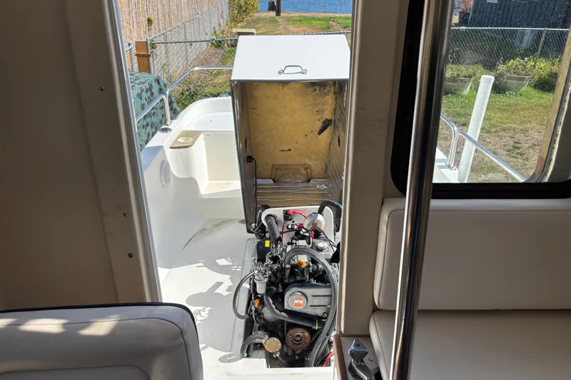 Slide: The Image of 2009 Ranger Tugs R-21 EC boat engine compartment view with open hatch. - 13