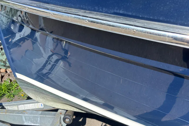 Slide: The Image of Close-up of 2009 Ranger Tugs R-21 EC boat hull with blue finish. - 17