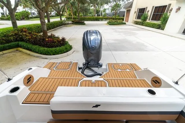 Slide: The Image of 2026 Starcraft SVX 211 OB boat with sleek deck design and modern outboard motor. - 11