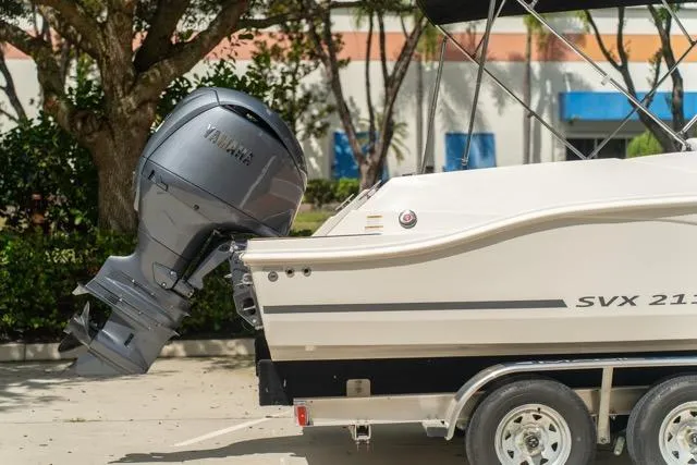 Slide: The Image of 2026 Starcraft SVX 211 OB boat with Yamaha outboard motor on trailer. - 7