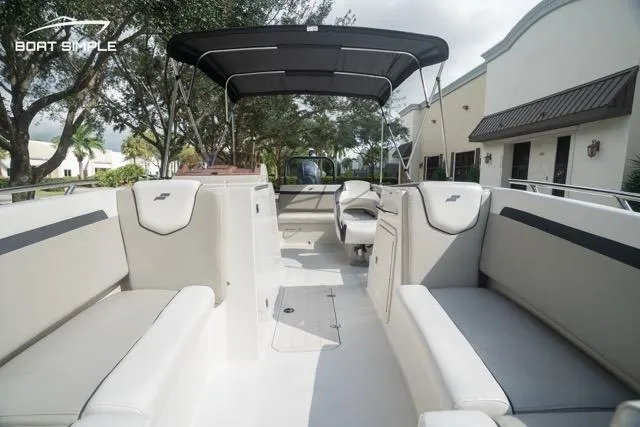Slide: The Image of 2023 Starcraft SVX 231 OB DH boat interior with spacious seating and canopy. - 9