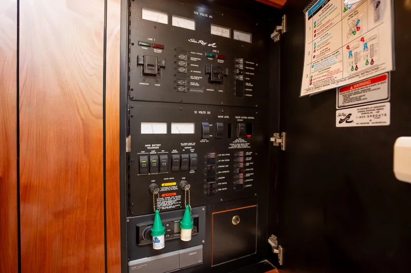 Slide: The Image of Electrical control panel of a 2003 Sea Ray 360 Sundancer boat. - 24