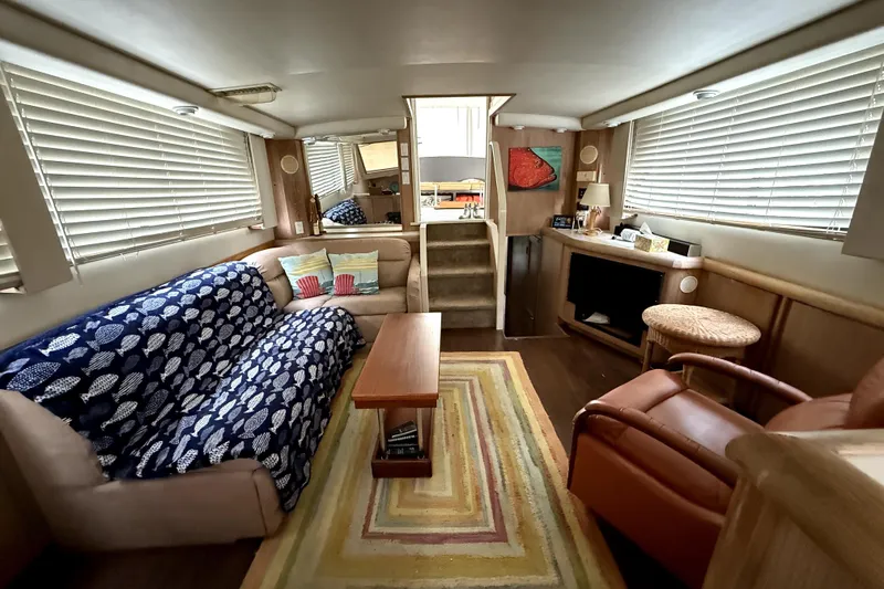 Slide: The Image of Luxurious interior of 1991 Californian 55 Cockpit Motor Yacht with cozy seating and decor. - 1