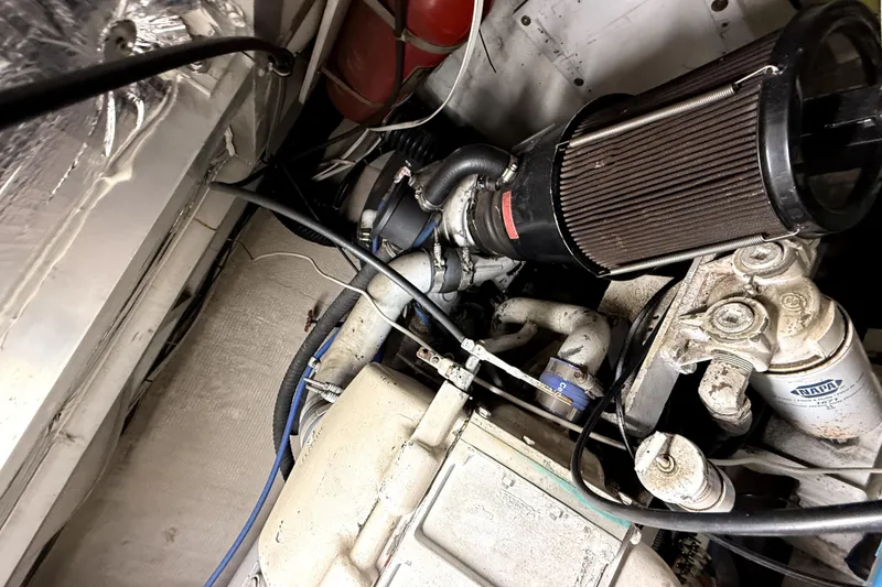 Slide: The Image of Engine room of 1991 Californian 55 Cockpit Motor Yacht with visible components and wiring. - 14