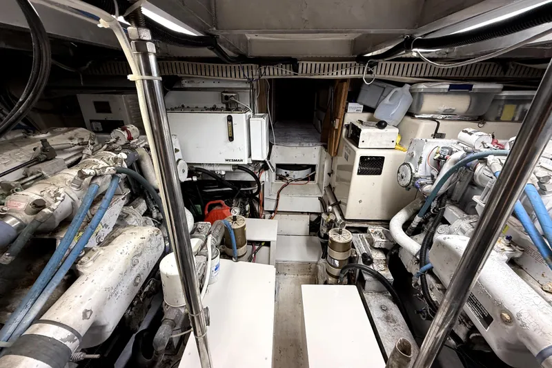 Slide: The Image of Engine room of a 1991 Californian 55 Cockpit Motor Yacht, showcasing machinery and equipment. - 15