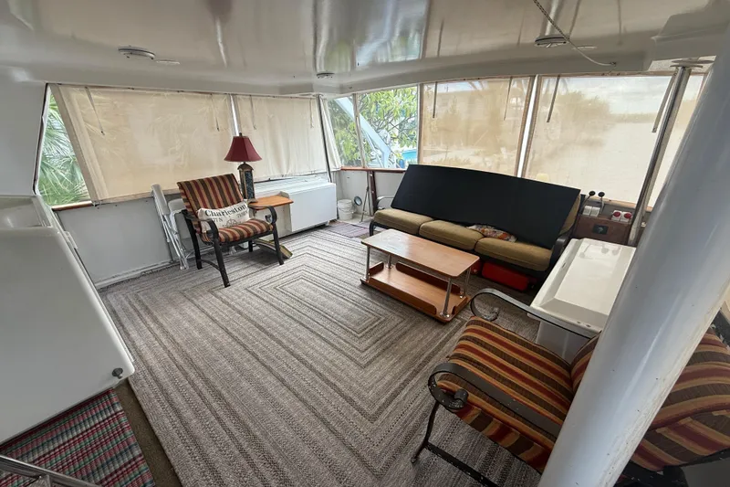 Slide: The Image of Interior of 1991 Californian 55 Cockpit Motor Yacht with cozy seating and decor. - 21