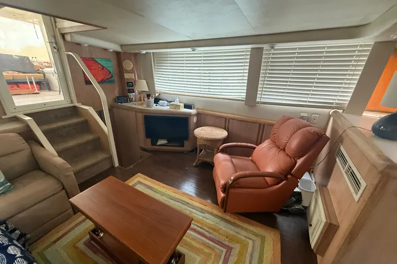 Slide: The Image of Interior of 1991 Californian 55 Cockpit Motor Yacht with cozy seating and decor. - 24