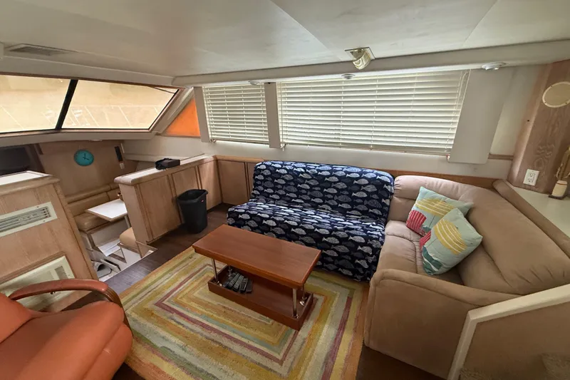 Slide: The Image of Interior of 1991 Californian 55 Cockpit Motor Yacht with cozy seating and nautical decor. - 25