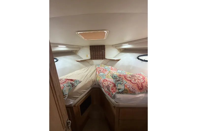Slide: The Image of Interior cabin of 1991 Californian 55 Cockpit Motor Yacht with colorful bedding. - 27