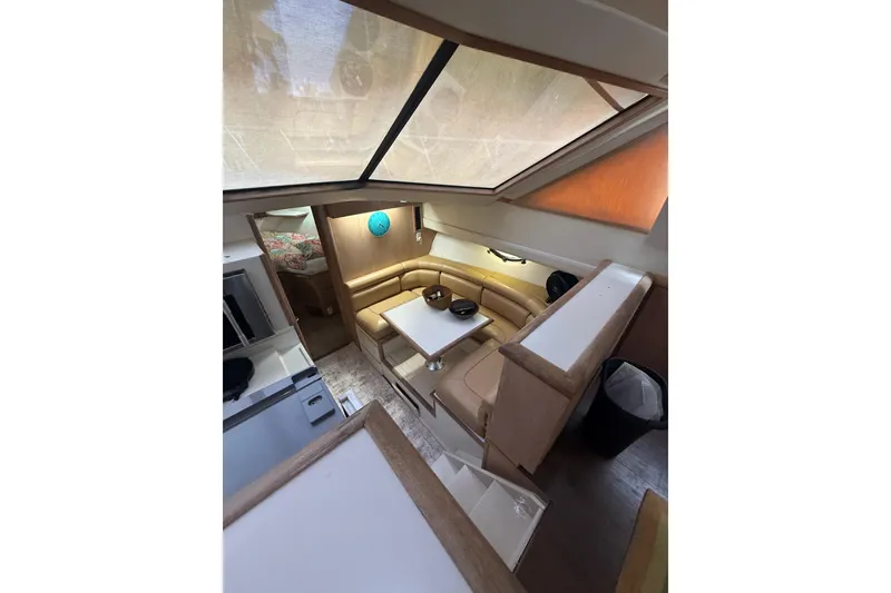 Slide: The Image of Interior of 1991 Californian 55 Cockpit Motor Yacht with cozy seating and dining area. - 28