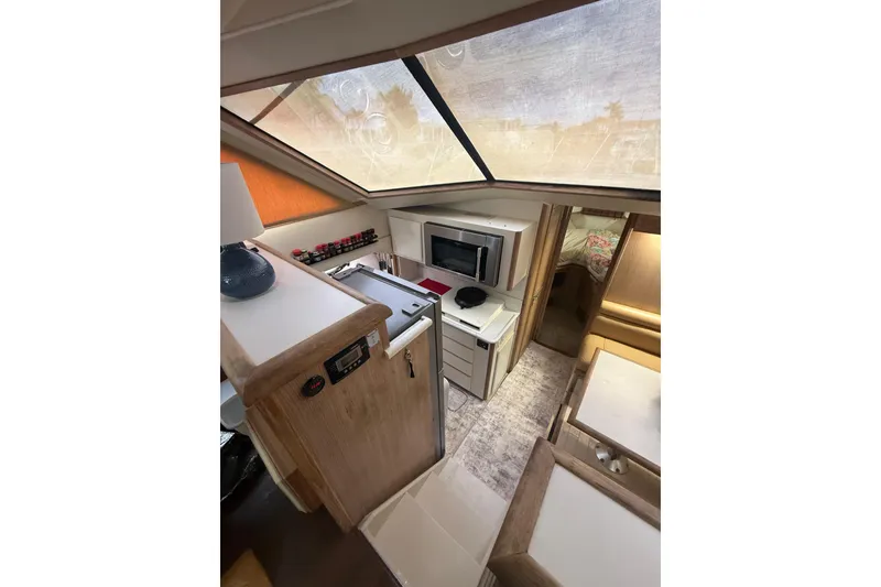 Slide: The Image of Interior of 1991 Californian 55 Cockpit Motor Yacht with kitchen and seating area. - 29