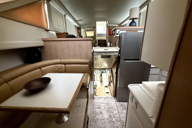 Slide: The Image of Interior of 1991 Californian 55 Cockpit Motor Yacht with dining area and kitchen. - 3