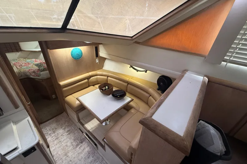 Slide: The Image of 1991 Californian 55 Cockpit Motor Yacht interior with cozy seating and dining area. - 41