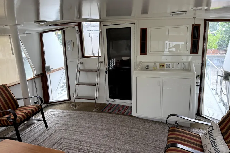 Slide: The Image of Interior of 1991 Californian 55 Cockpit Motor Yacht with seating and kitchenette. - 9