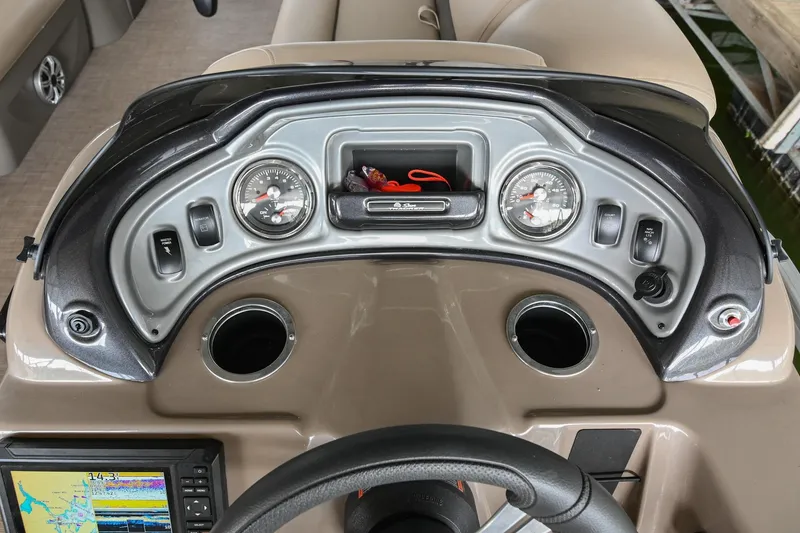 Slide: The Image of Dashboard of 2023 SUNTRACKER DLX 22 Sportfish boat with gauges and controls. - 17