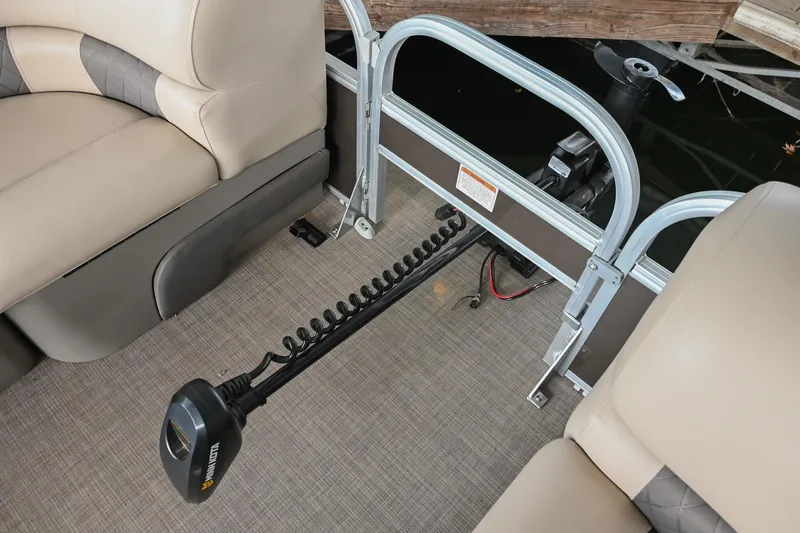 Slide: The Image of 2023 SUNTRACKER DLX 22 Sportfish interior with trolling motor and comfortable seating. - 25
