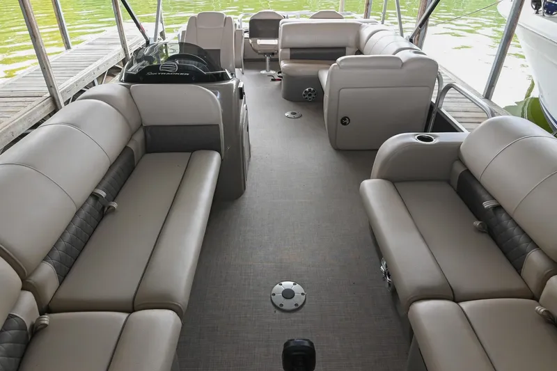 Slide: The Image of 2023 SUNTRACKER DLX 22 Sportfish interior with spacious seating and modern design. - 5