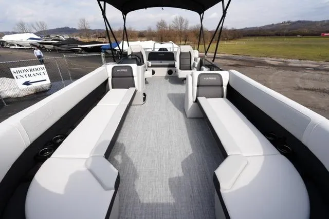 Slide: The Image of 2026 Harris Cruiser 250 pontoon boat with spacious seating and modern design. - 10