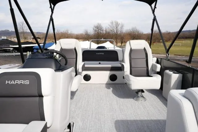 Slide: The Image of 2026 Harris Cruiser 250 pontoon boat interior with plush seating and modern design. - 12