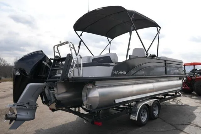 Slide: The Image of 2026 Harris Cruiser 250 pontoon boat with canopy on a trailer. - 7