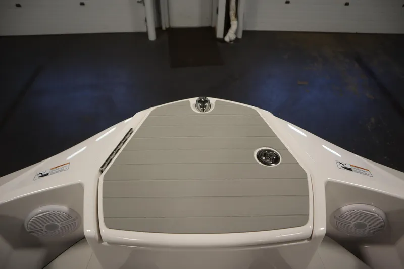 Slide: The Image of 2026 Yamaha Boats SX220 bow with speakers and sleek deck design. - 11