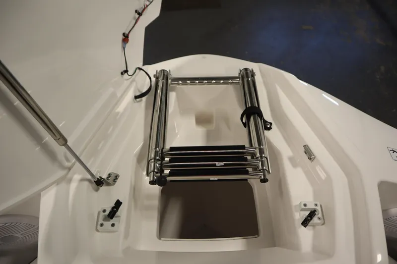 Slide: The Image of 2026 Yamaha Boats SX220 bow with stainless steel ladder and storage compartment. - 12
