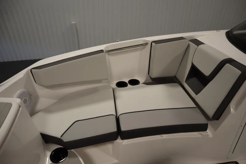 Slide: The Image of 2026 Yamaha Boats SX220 interior seating with cup holders and modern design. - 15