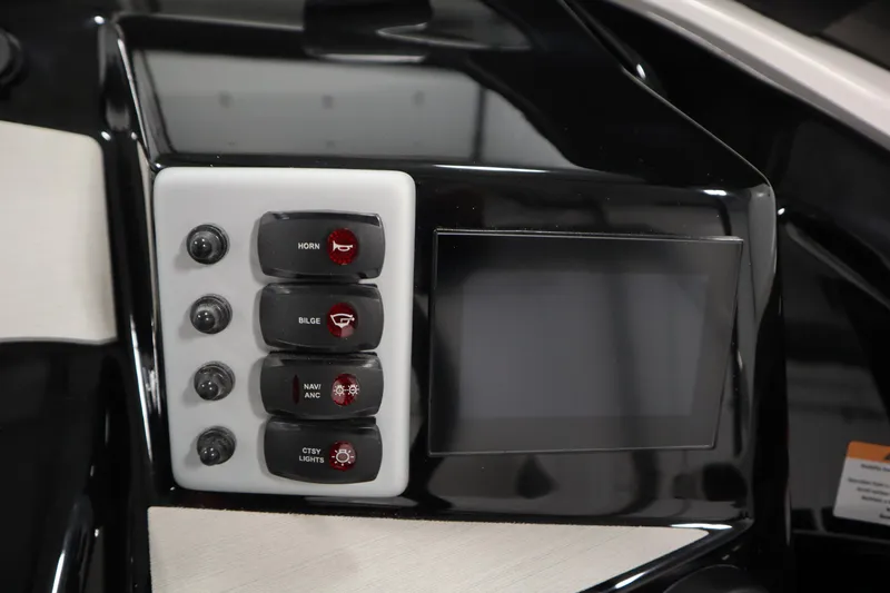 Slide: The Image of Control panel of 2026 Yamaha Boats SX220 with switches and display screen. - 22