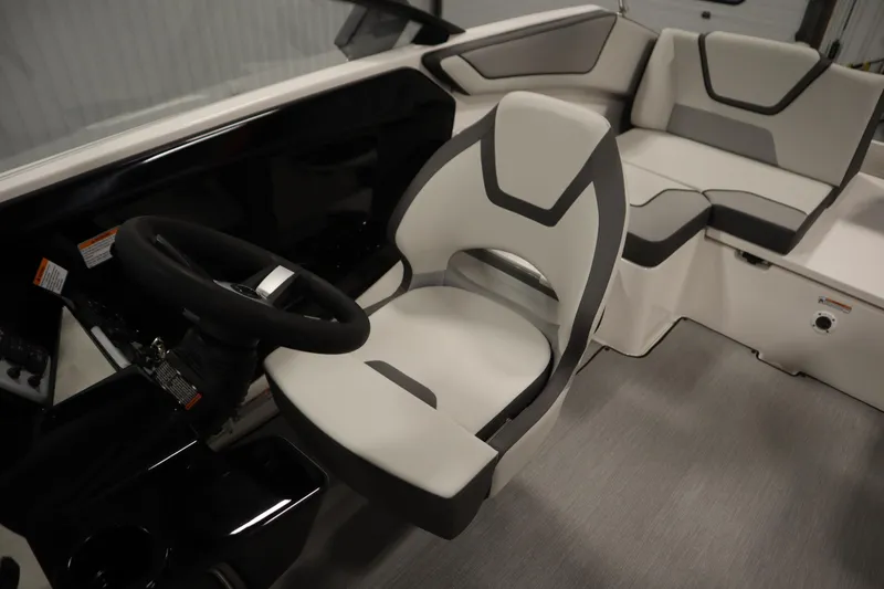Slide: The Image of 2026 Yamaha Boats SX220 interior with modern helm and seating design. - 25